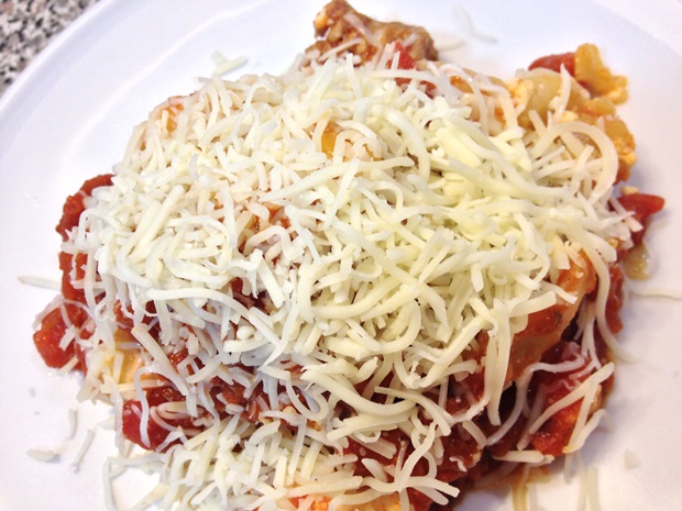 slow cooker lasagna garnished with Italian cheese