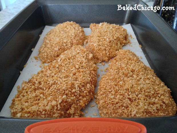 coat the chicken breasts with breadcrumbs